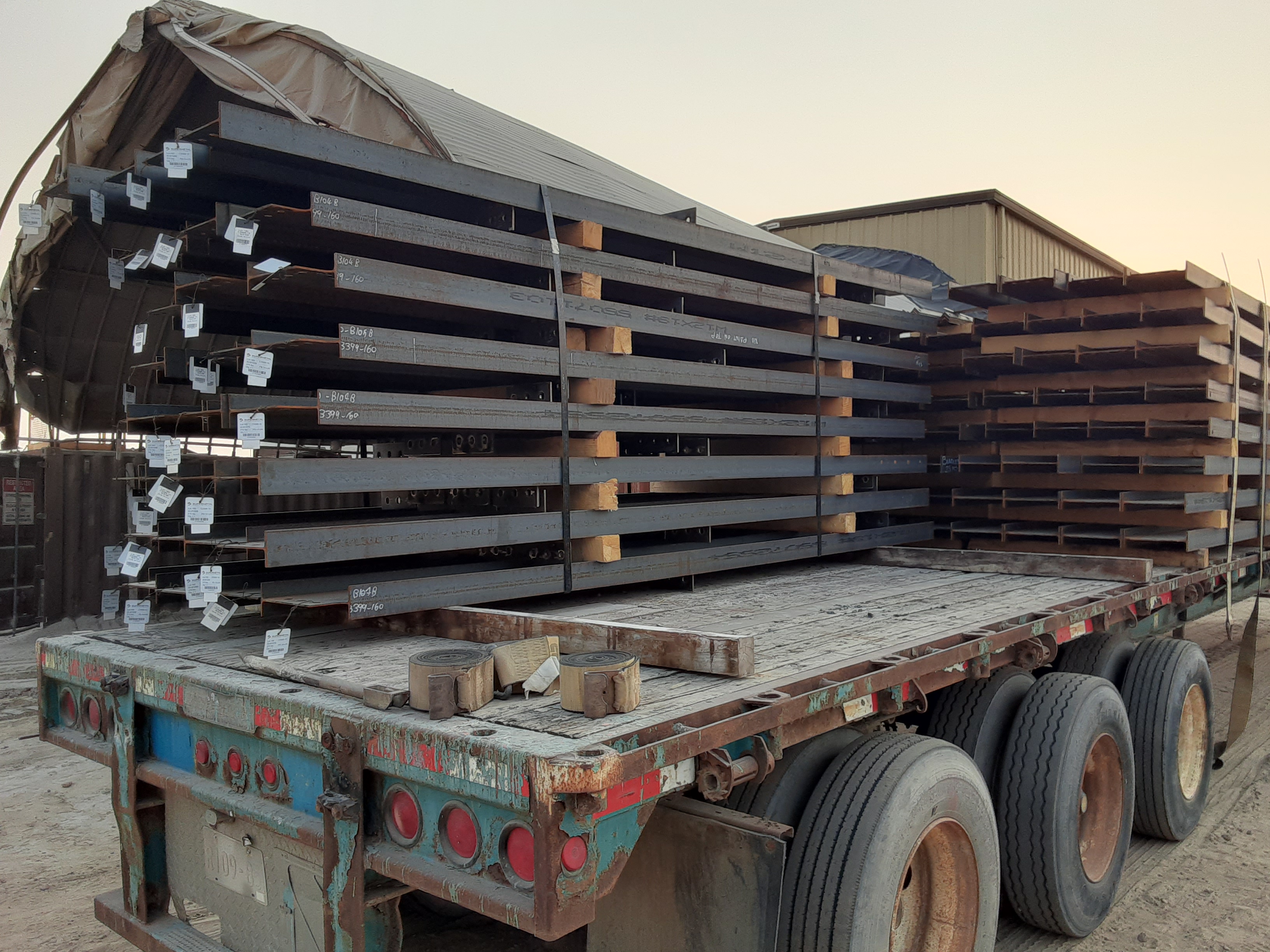A load of painted structural loaded on a trailer.